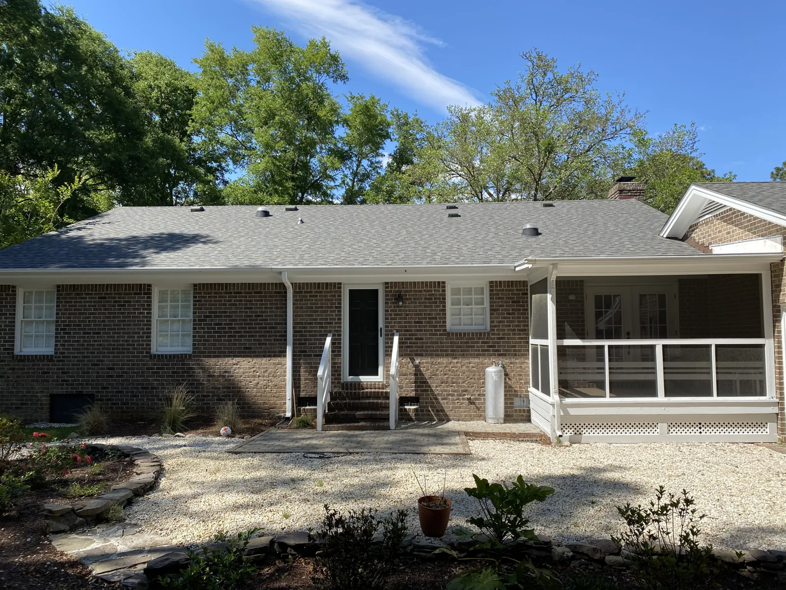 Brick ranch home in mainland coastal North Carolina with a new gray asphalt shingle roof