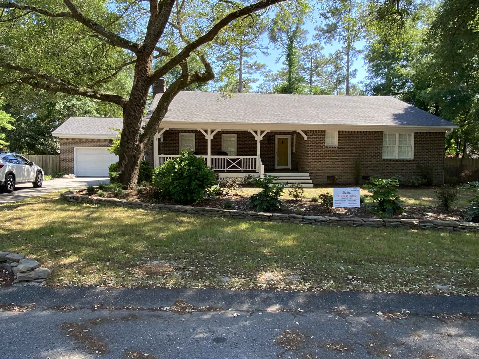 Home with a completed roof replacement by Patriots Roofing