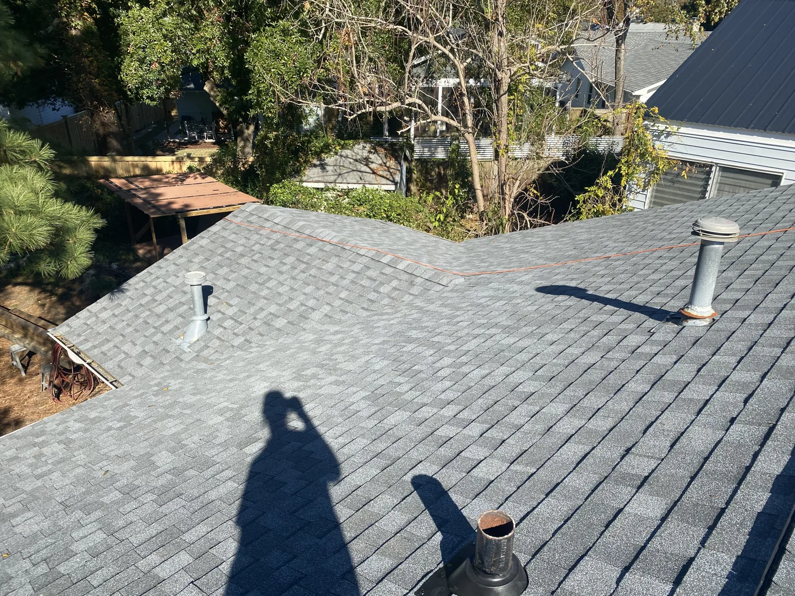 Completed asphalt shingle roof replacement, aerial view