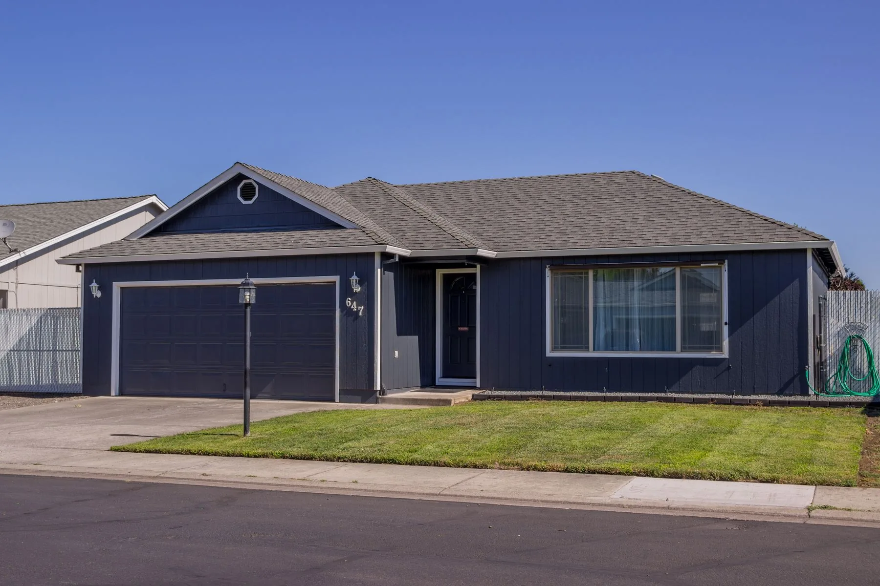 Single-story West Texas home with a newly installed architectural asphalt shingle roof by Patriots' Roofing